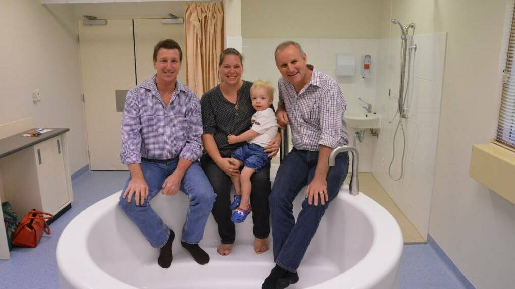  Member for Katherine Willem Westra van Holthe, Mellyssa and Mason Tracey, and Health Minister John Elferink check out the new birthing bath at Katherine Hospital on July 17.