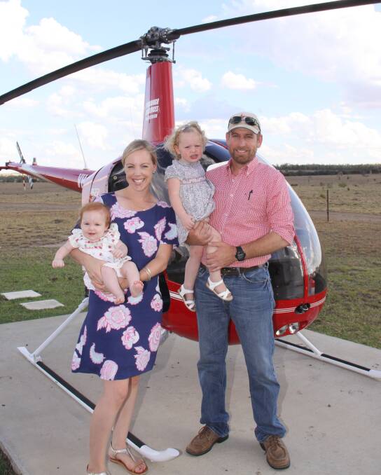 Scott Spredborough with his wife Cara and children Sophia and Eadie. It is almost a year since he had a serious helicopter accident. Picture: Supplied