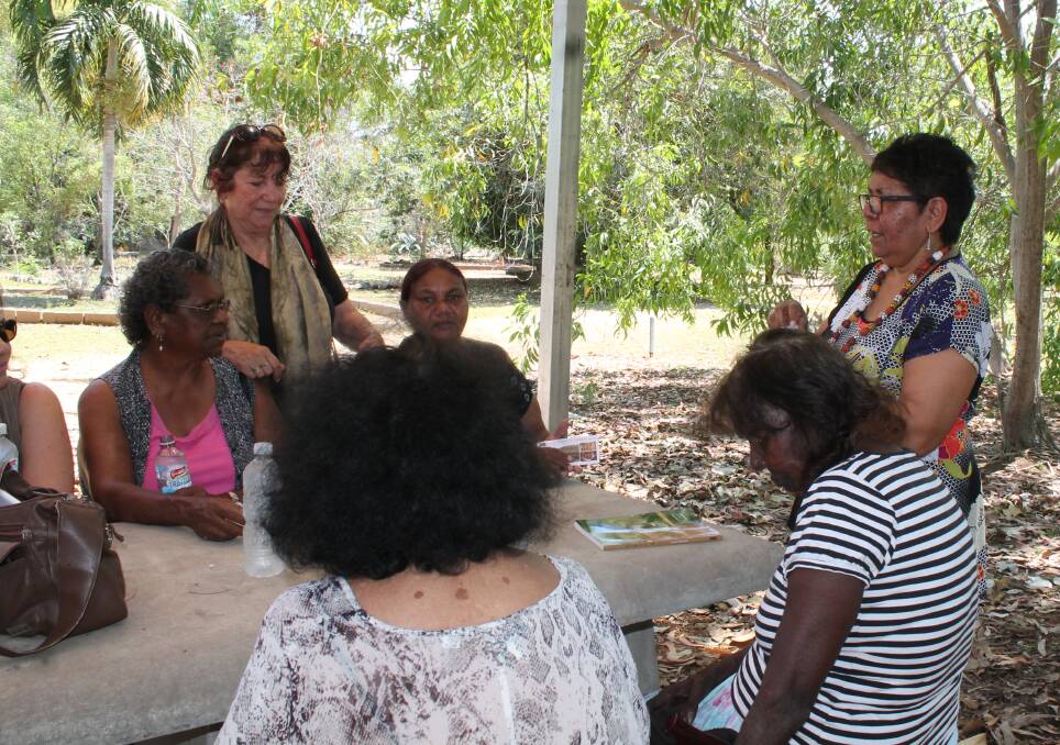HAVING A YARN: Florence Onus chatting to local Elders.