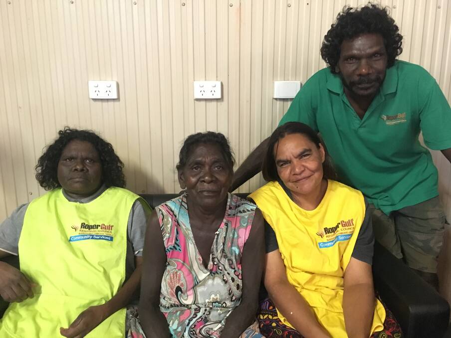 LIFE LESSONS: Roper Gulf Regional Council Aged Care staff Helen Sambo,Kaylene Wurramarrba and Ernie Andrews talk to Ngukurr client Helen Harrison about her life.