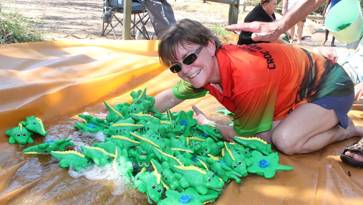STOP THE CROCS: 1000 mini plastic crocodiles launched down a big slip and slide on Saturday morning. 