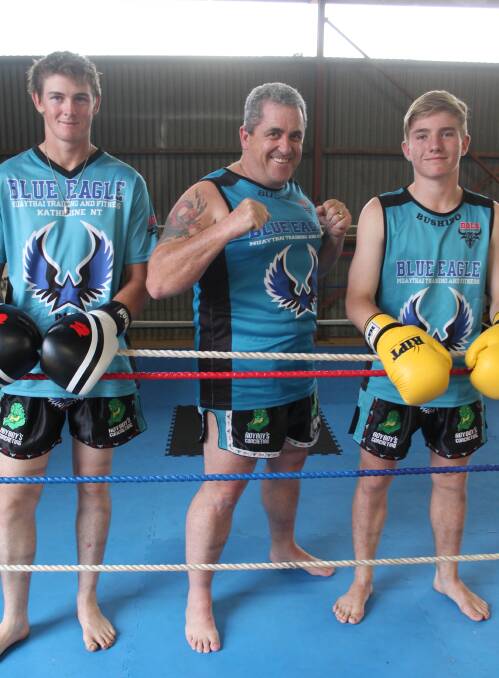 FIGHT CLUB: Tom Davidson, David Flood and Trey Eiermann gear up for a fight at the Blue Eagles gym at the Katherine Showgrounds.