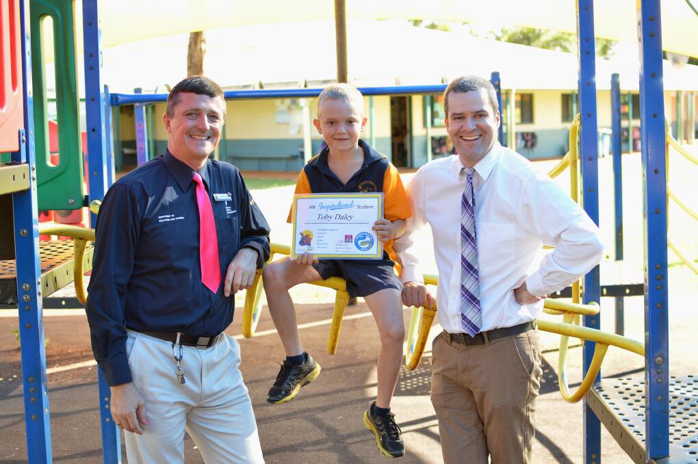 CASUARINA CONGRATULATIONS: Teacher Rodney Gregg and principal John Cleary chat to Year 4 student Toby Daley about winning the school's PARRA Medal ahead of his half-time appearance at TIO Stadium next month.