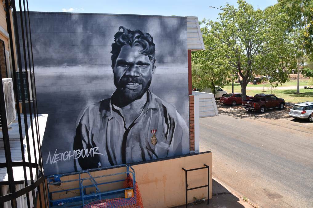 A black and white portrait of an Alawa man, known as Neighbour, who saved the policeman who'd arrested him moments before from drowning in a river was the first mural to be painted on Railway Terrace. Picture: Roxanne Fitzgerald. 