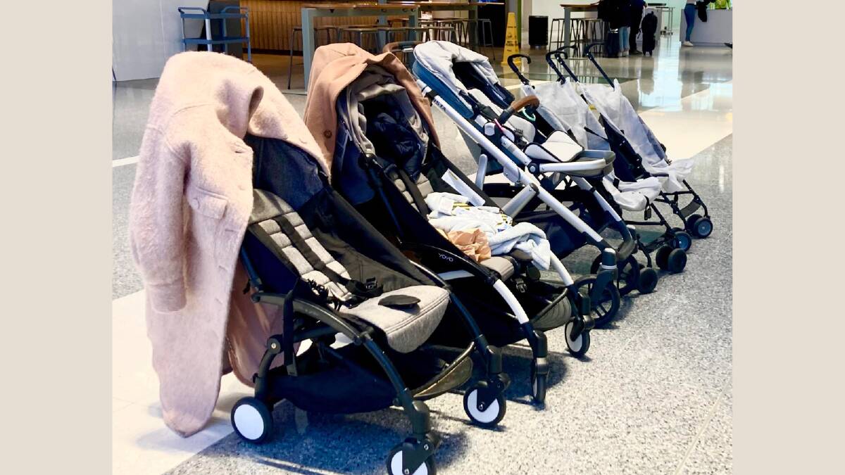 Prams abandoned by fleeing parents; lined up for collection at Canberra Airport. Picture: Lanie Tindale 
