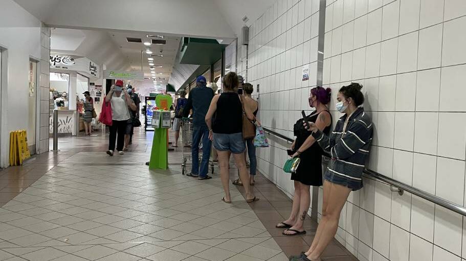 Queues have been used outside Woolworths to manage staff shortages. 