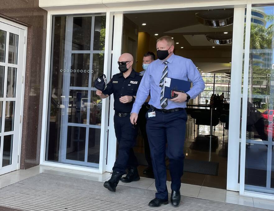 Senior Constable Shane McCormack (left) leaves the Darwin Supreme Court after giving evidence. Picture: Sarah Matthews