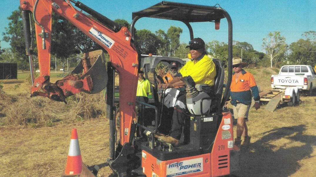 Sherrise Ahwon behind the wheel of a mini excavator. Picture: Supplied