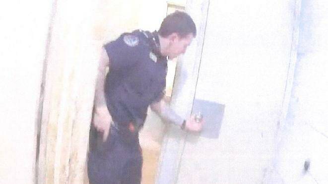 Body worn-camera footage shows Constable Rolfe had disengaged the safety devices on his gun during a search of a house in Yuendumu. Picture: Supreme Court of the NT
