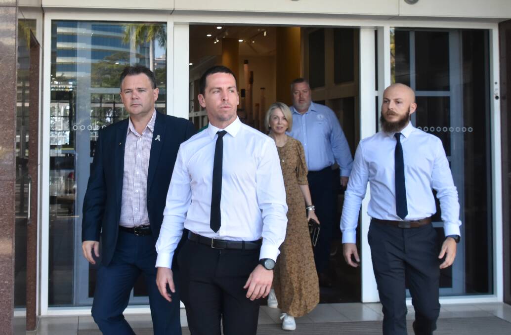 Zachary Rolfe (centre) leaving the Darwin Supreme Court. 