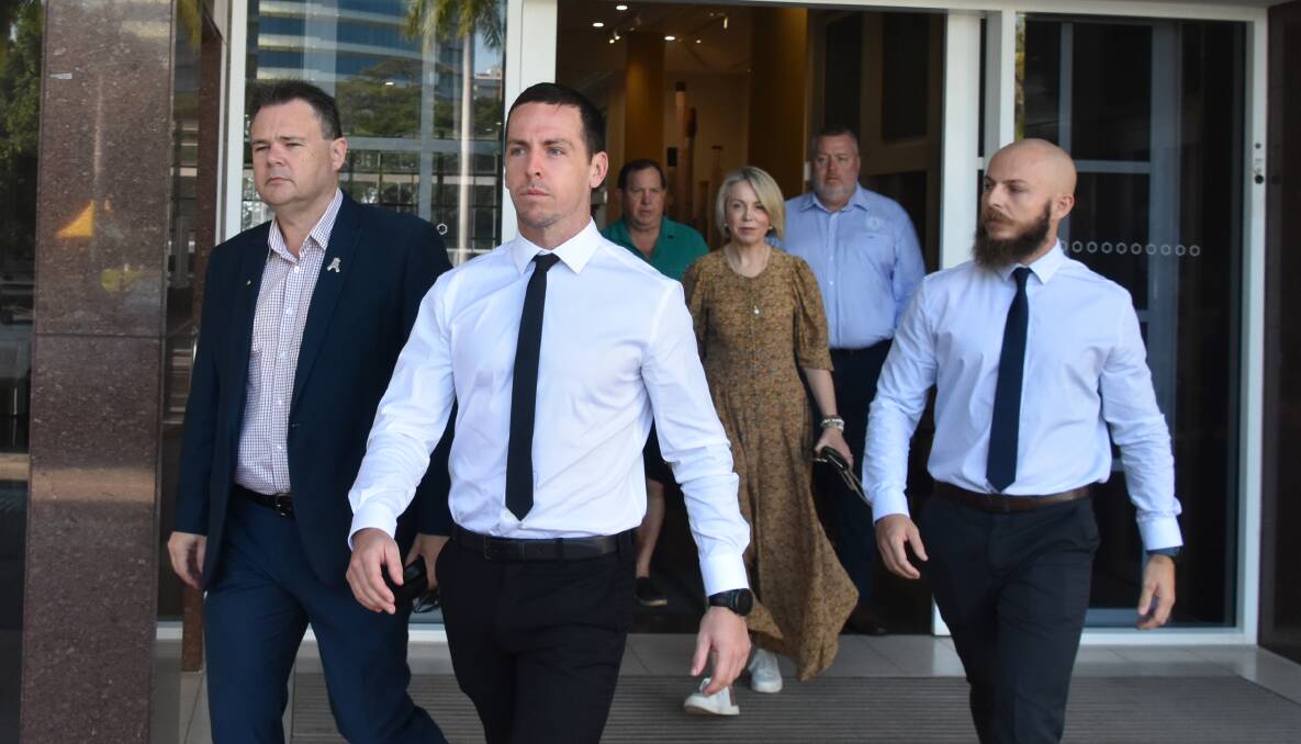 Constable Zachary Rolfe (centre) leaves the Darwin Supreme Court. 