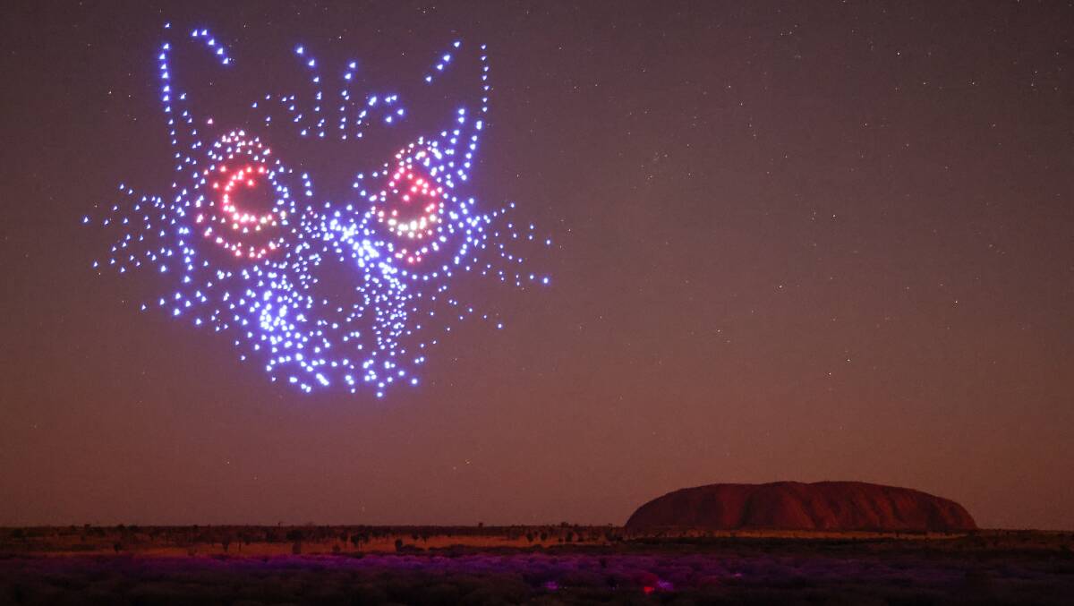 Kurpany, the devil dog, rises from the mulga scrub as part of the Wintjiri Wiru drone, sound and light show at Uluru in the Northern Territory launched on May 10, 2023. Picture Getty Images for Voyages Indigenous Tourism Australia