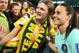 Matildas player Hayley Raso greets an Australian supporter following the side's loss to Sweden in Brisbane on Saturday night. Picture from Getty Images.
