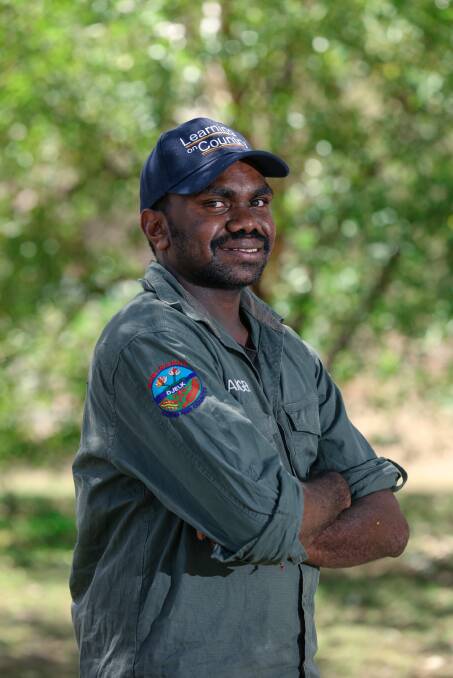 "Ever since I got my green shirt on, I look at myself in the mirror and can't believe that I made it. I'm a real ranger now." Djelk Ranger Jonah Ryan is a former Learning on Country Program participant. Picture: Glenn Campbell.
