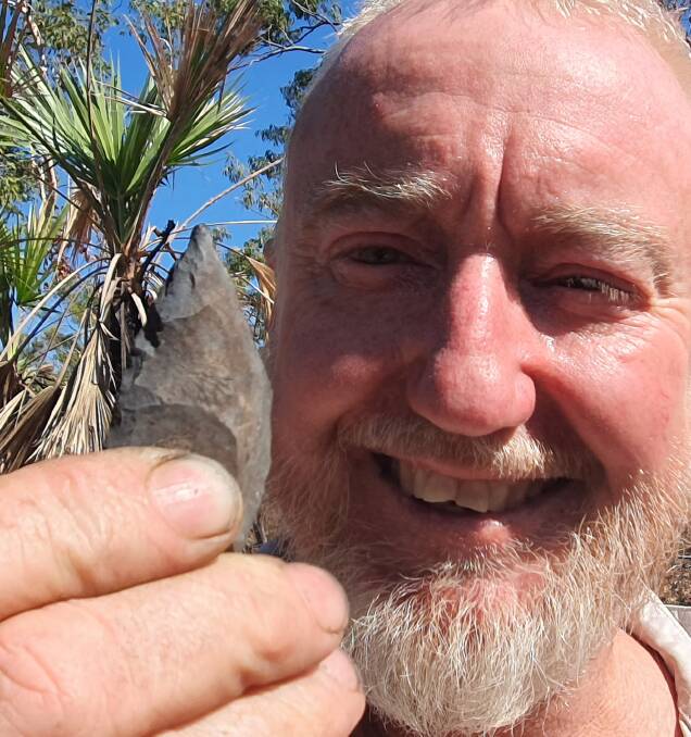 John Beasy with on of the artefacts he found in the Northern Territory.