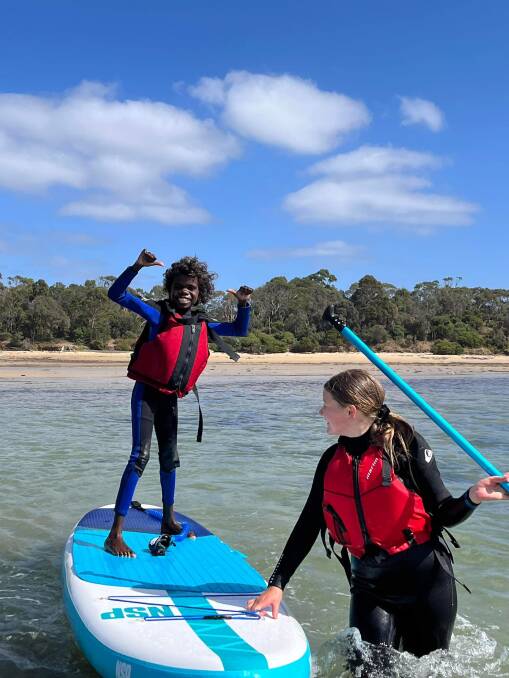 Stand-up paddleboarding was one of the highlights of the school trip. 