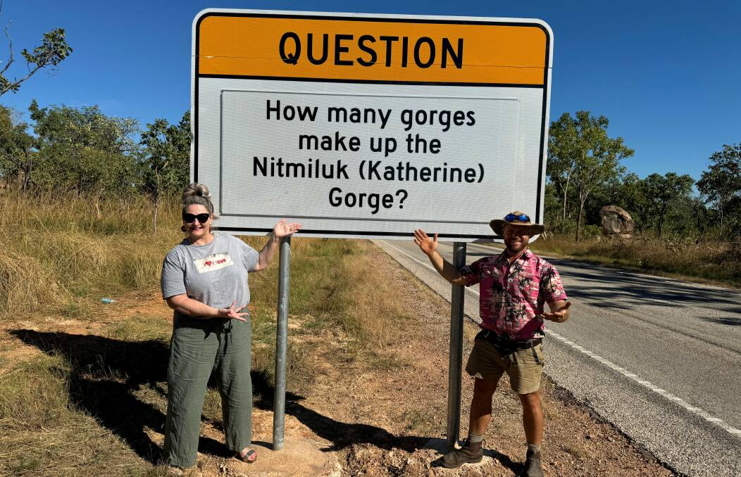 Katherine Town Council CEO Ingrid Stonhill with alderman Jeremy Trembath at one of the new roadside trivia signs. Do you know the answer?