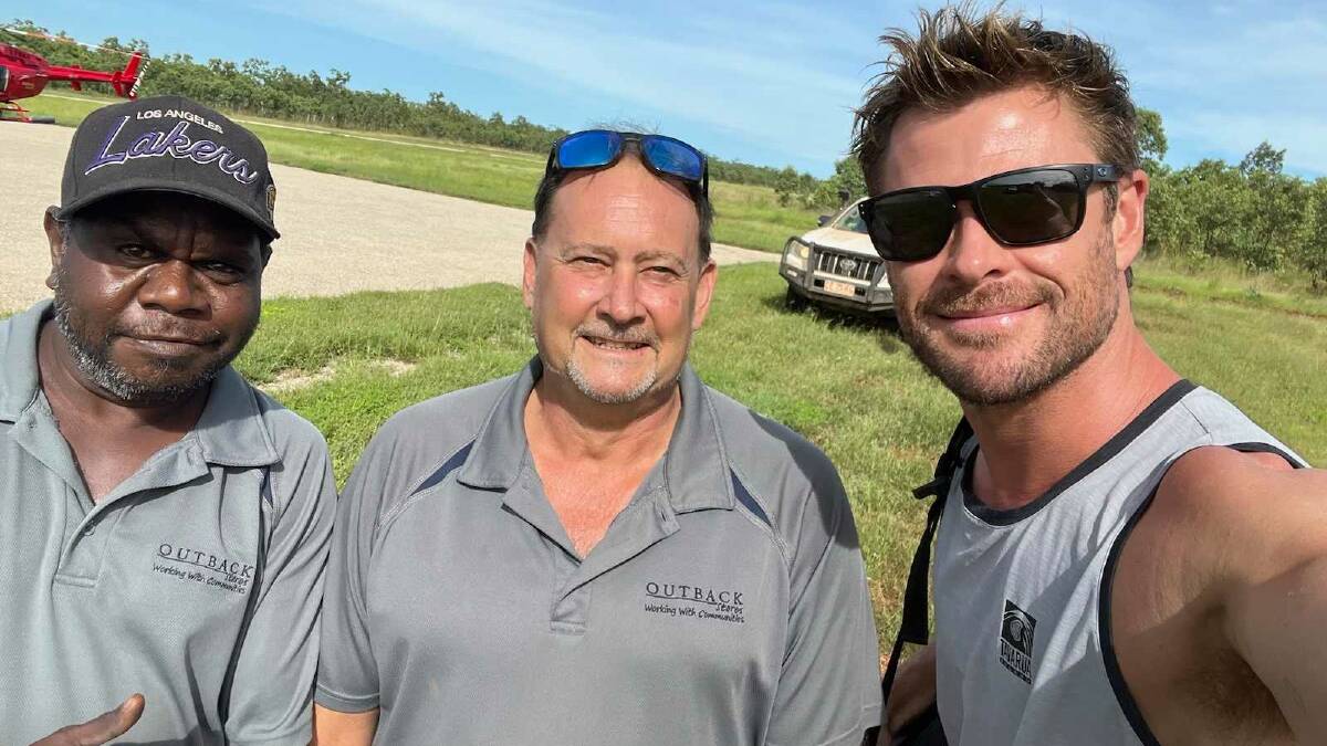 Megastar Chris Hemsworth has landed in Bulman, NT, taking happy snaps with local store manager Tony Fogg and Robbie Dalywater. 