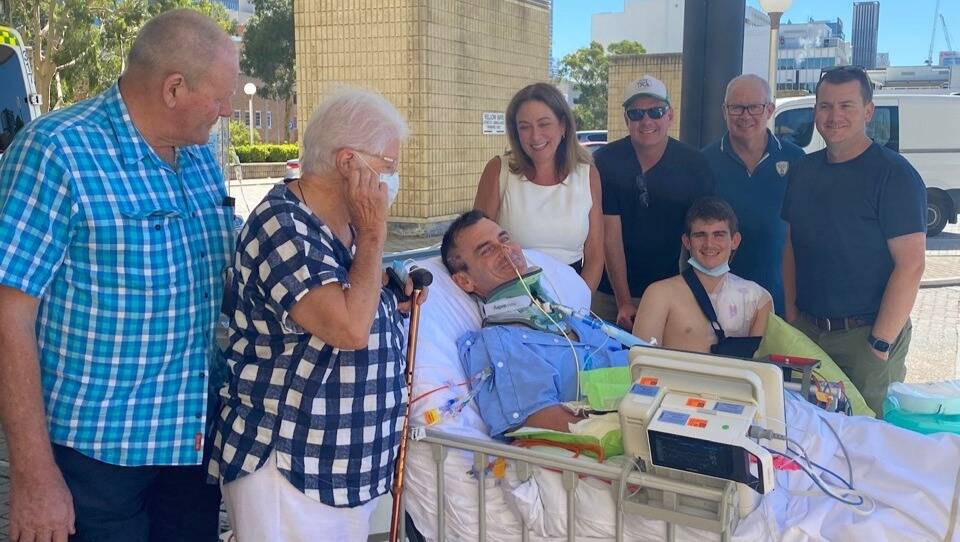 Charles McGregor-Shaw surrounded by loved ones at Perth hospital. 