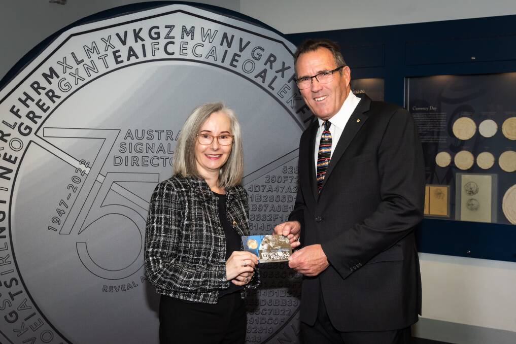 Australian Signals Directorate director-general Rachel Noble and Royal Australian Mint CEO Leigh Gordon celebrate the release of the 75th anniversary coin. Picture supplied
