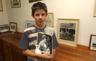 Sam, with a photo of his mum in 2007.