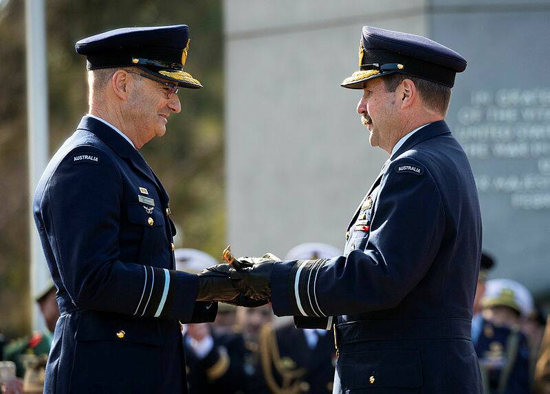 Air Marshal Leo Davies, AO, CSC presents Air Marshal Mel Hupfeld, AO, DSC with Sir Richard Williams' sword during a ceremonial parade held for the handover of command of the Royal Australian Air Force. Picture: Department of Defence. 