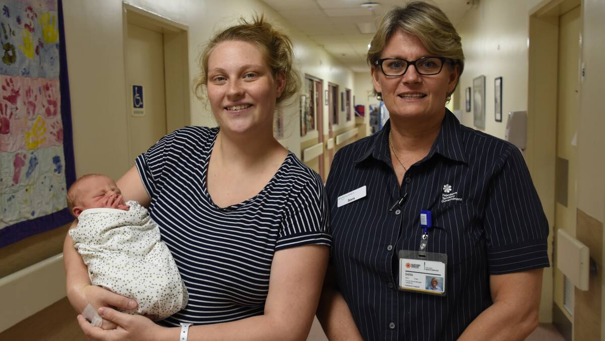 Jamie Maxey and her new baby boy Jaedan Maxey, with clinical midwife manager Sara Potter at Katherine Hospital. 