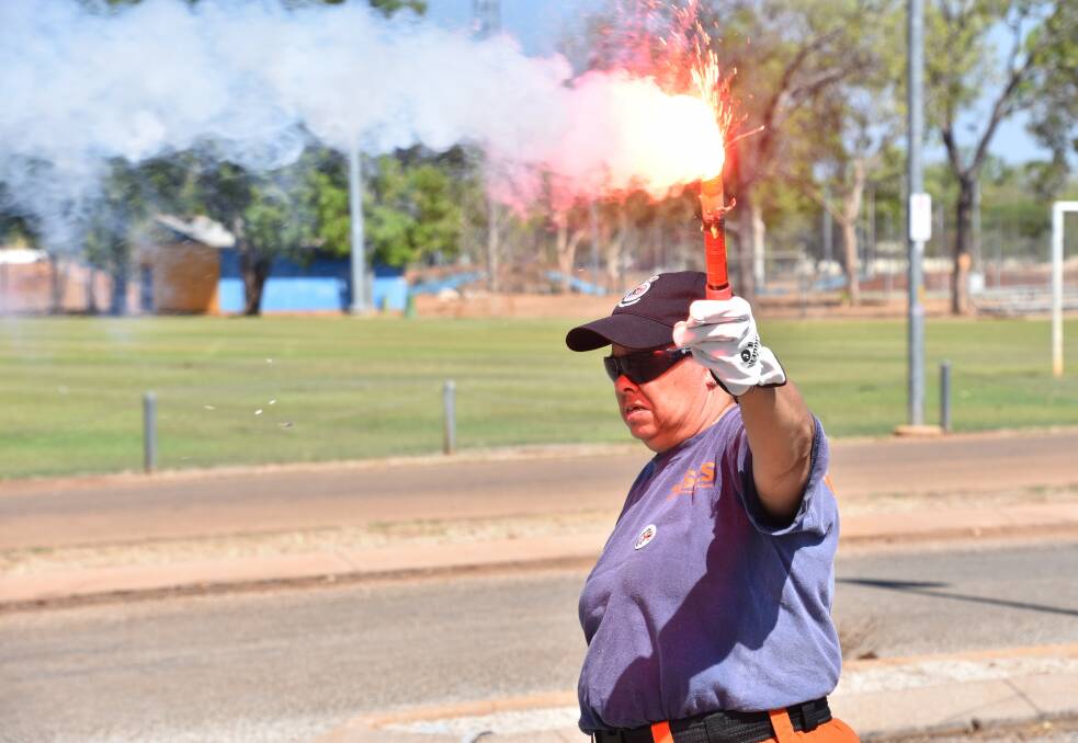 Lighting an emergency flare at the Katherine Community Safety Expo was one of the highlights. 
