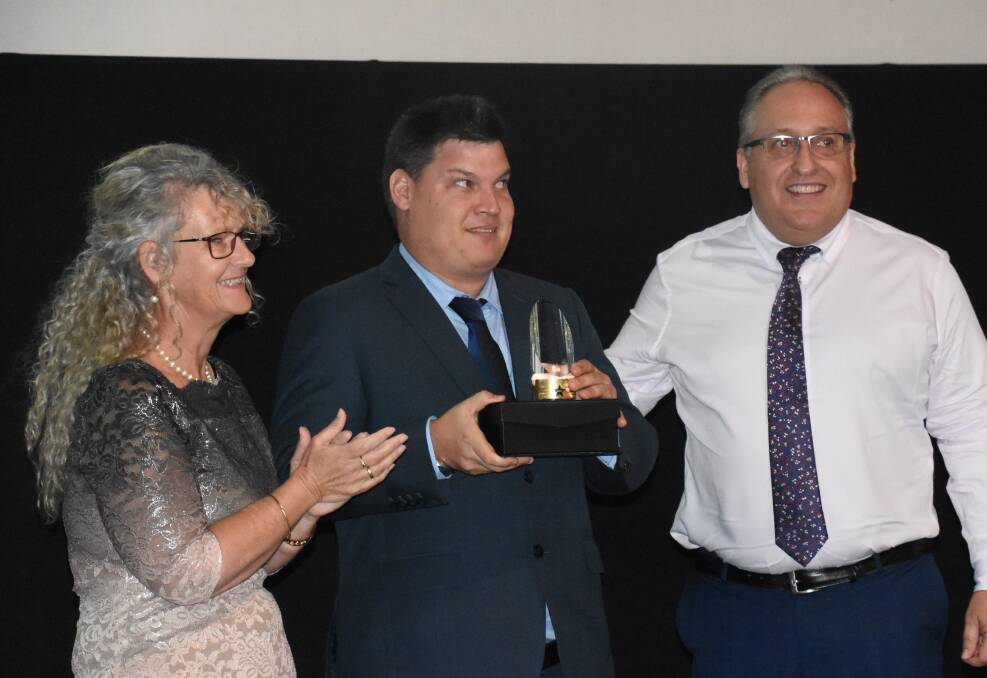 CEO of NT Friendship and Support Stephanie Ransome and one of Equalitea's key employees Anthony Smith, accept the People's Choice award at the annual Chamber of Commerce Customer Service Awards. 