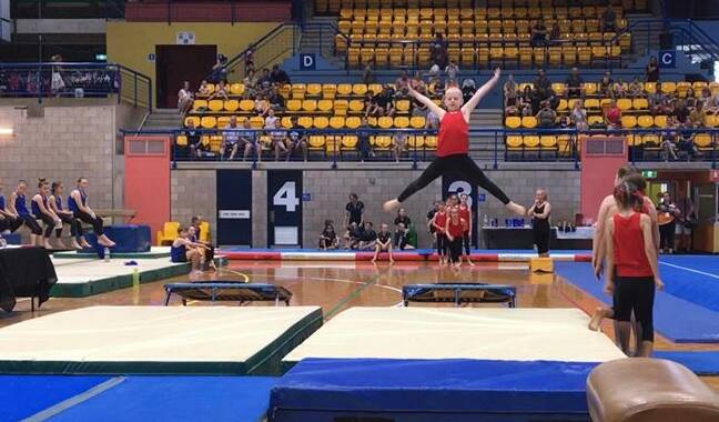 Keira Kariko takes to the air in the Team Gym trampoline competition. Picture: Supplied. 