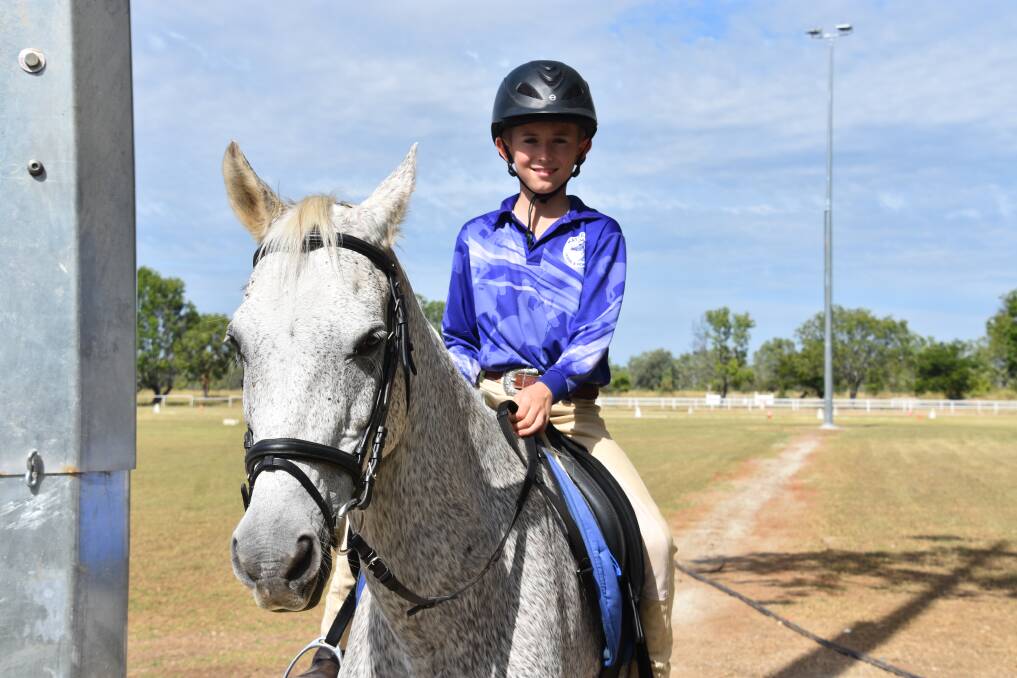 BRIGHT LIGHTS: Harrison Branson, 10, and his horse Native will be able to train much more often, in cooler times of the day with the installation of four new lights at the Katherine Horse and Pony Club. 