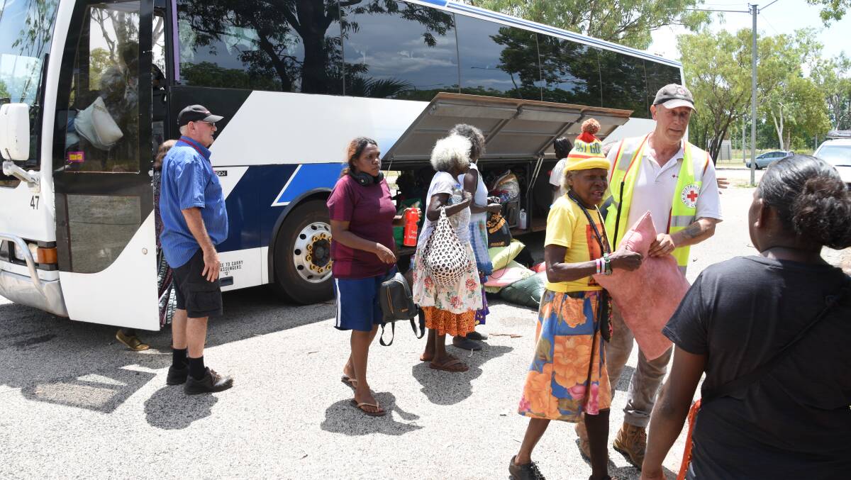 Numbulwar residents disembark the first bus to arrive in Katherine at about 1.30pm today. 