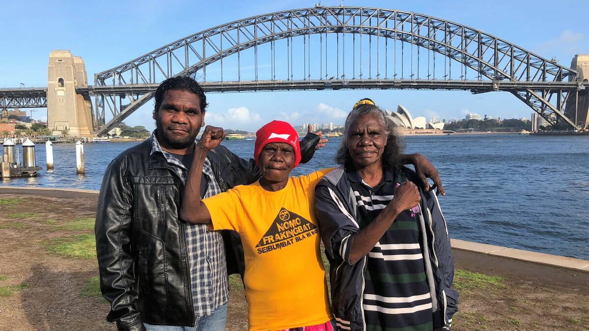 NO FRACKING: Stuart Nuggett, May August and Stephanie Roberts from the NT in Sydney ahead of Origin's Annual General Meeting. Photo: Protect Country Alliance. 