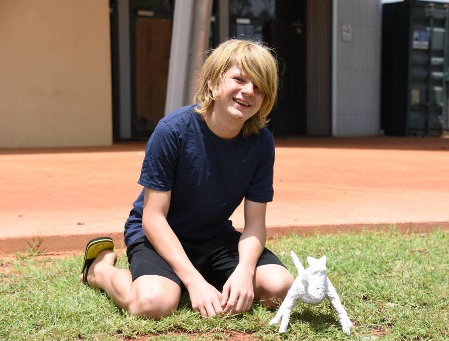 Logan Kariko attended his first school holiday workshop this week to fashion a small dog model out of recycled materials. 