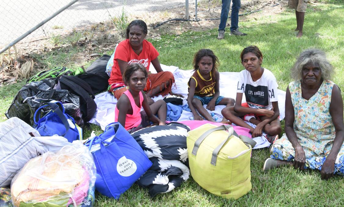 EVACUATED: Numbulwar residents Mavis Ngalmi. Gracie Bell, Curtis Ggylmi, Jessie Elle and Mara Murrungun boarded a bus at 6am this morning with essential belongings, to escape the fearsome cyclone brushing past their isolated town. 