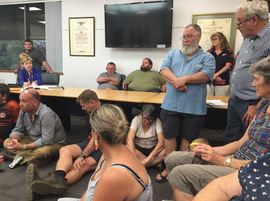Residents in support of saving the museum lined the walls and sat on the floor. 