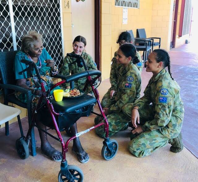 The Northern Territory's Remote and Indigenous Army Cadets happily chat to residents at Kalano Flexible care. Picture: Nicki Asling. 