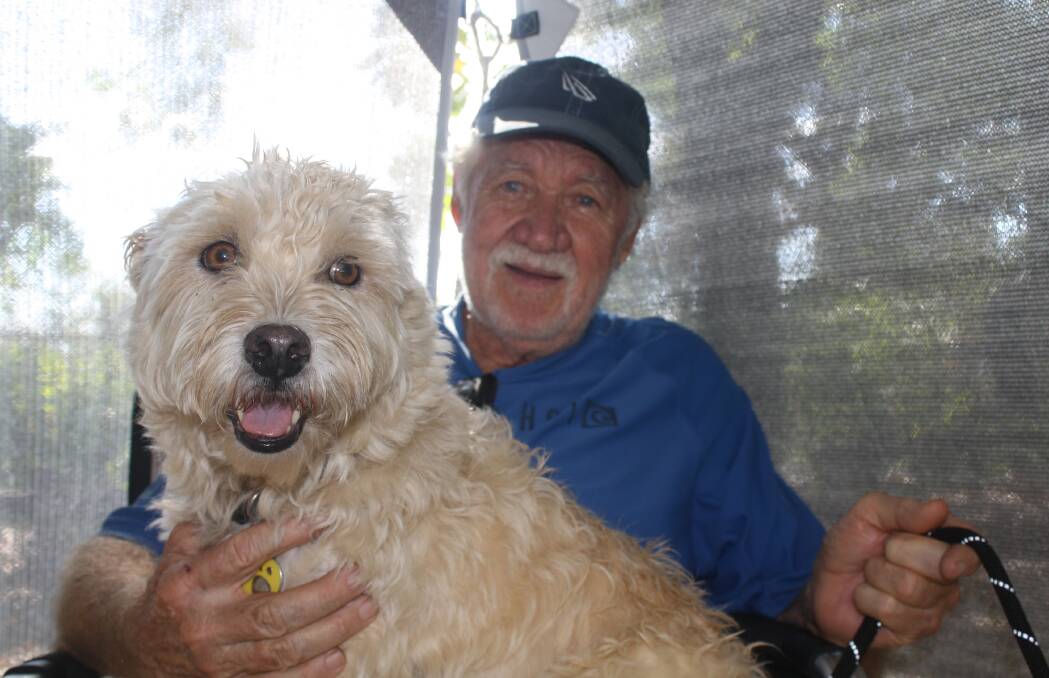 Gordon Kemp with his dog Bella said he doesn't mind the slow caravan park price rises if he sees the money being spent on facilities.  