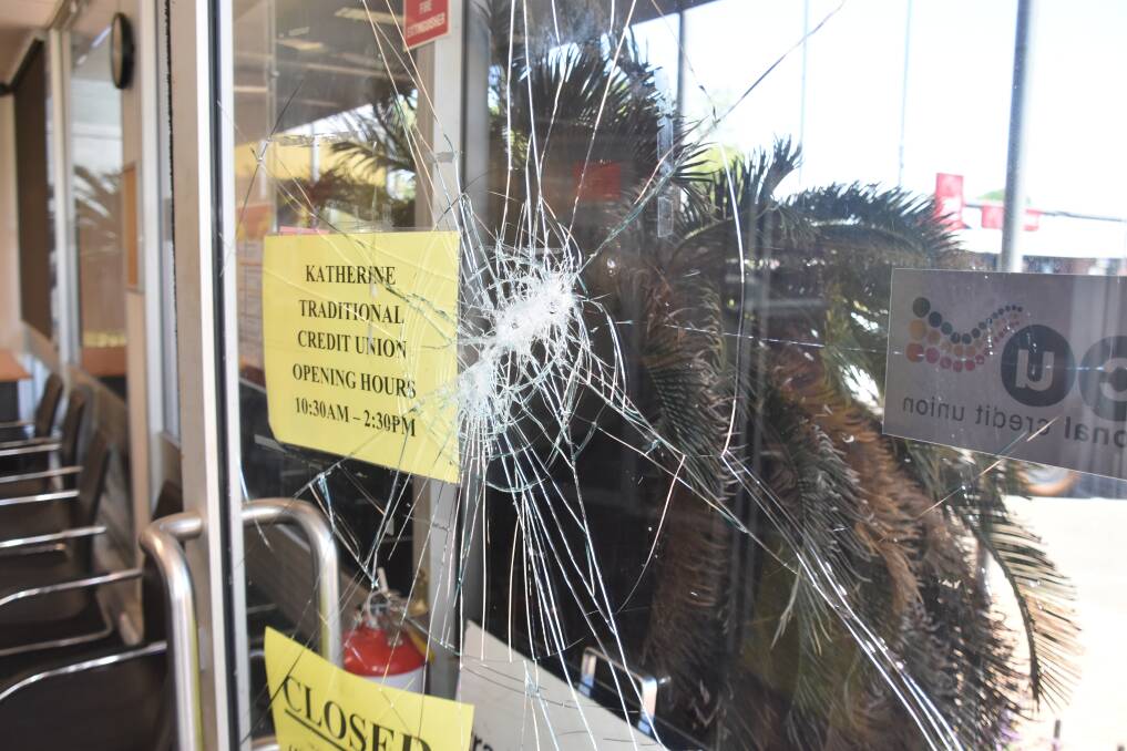Katherine Traditional Credit Union's front entrance has been smashed multiple times. 