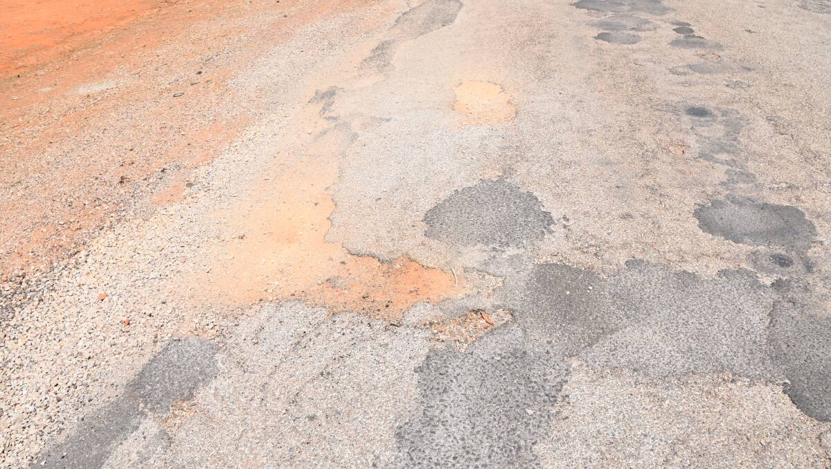 DILAPIDATED: Large pot holes on McKeddie Road make for a bumpy ride into Kalano Aboriginal Community. 