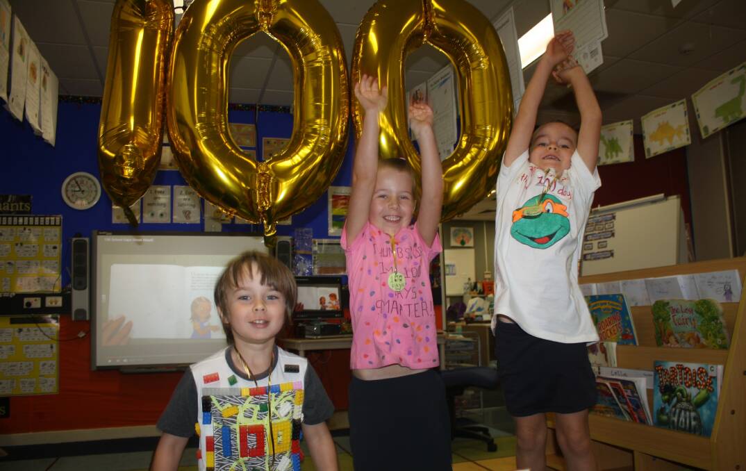 100 DAYS OF TRANSITION: Cooper Moran, Emily Lauder and Ruby Halls excited to have made it through 100 days of school. 