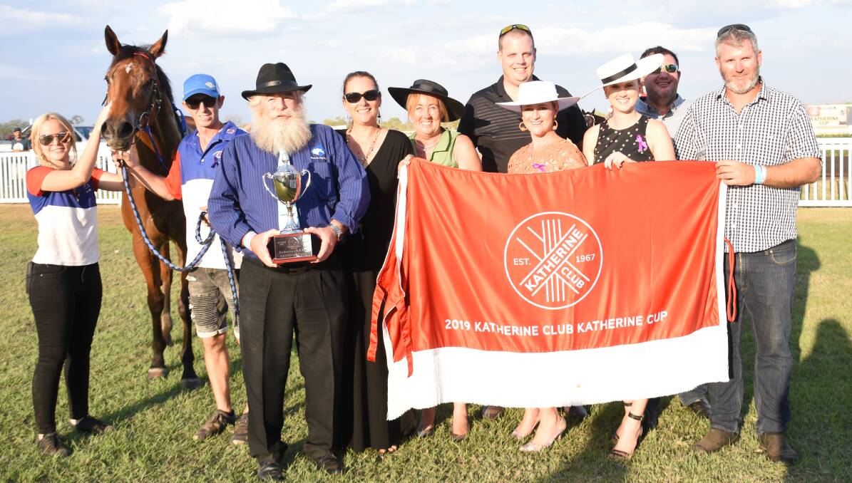 Josh McShanag (far right) with members of the syndicate, the Katherine Cup and Downhearted. 