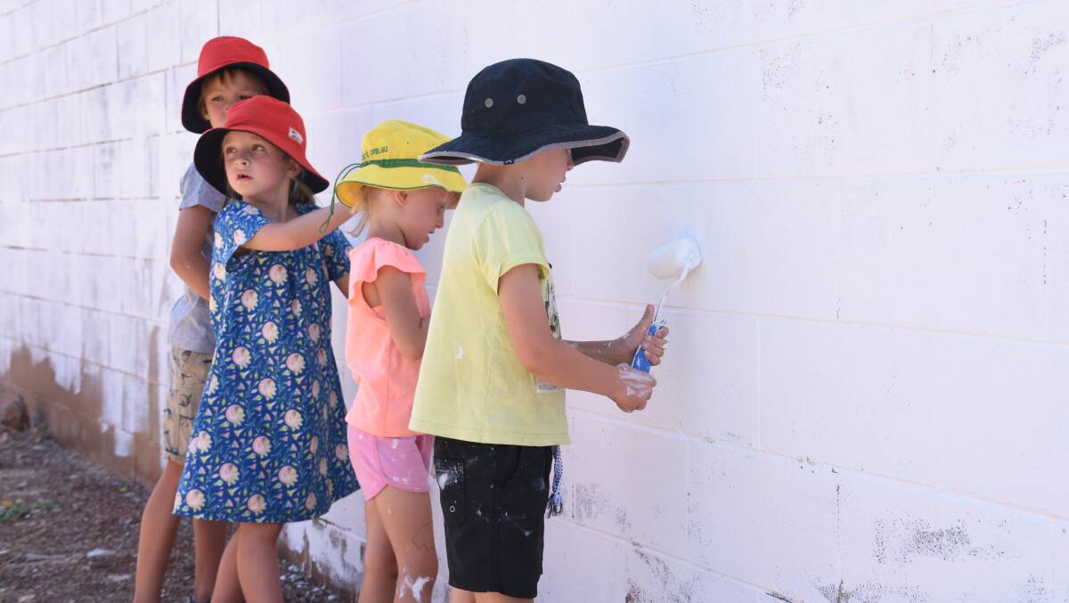 Edie Gardner, Lenny Gardner, Zoe Hard and Alex Hard take part in the first youth led mural, taking shape this week. 