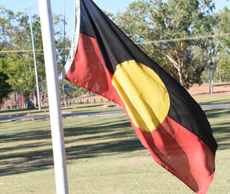 The Indigenous flag was raised on the centre poll. 