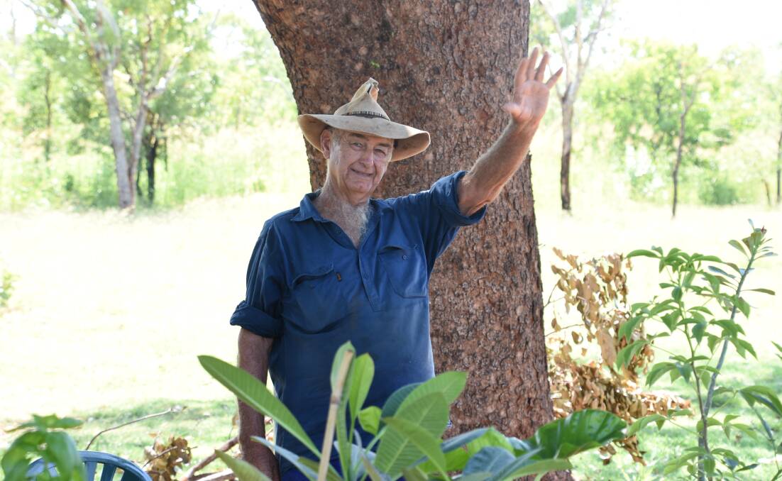 SAVED: Jim Ashworth spends three days per week under the shade of a big mahogany on the Stuart Highway, he said he is happy it will not be cut down. 