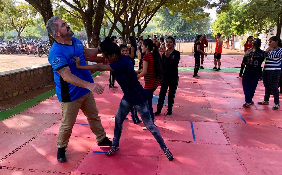 Spread over one week, 950 girls between the ages of 14 and 18, at Dhote Bandhu Science College in Gondia, India, spent about 45 minutes with the trainer learning self-defence skills. Picture: David Flood. 