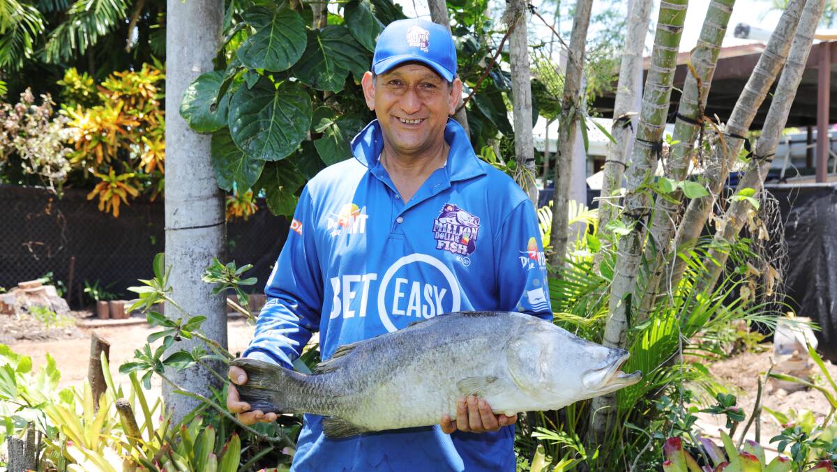 CATCH: Basil Te Aho with his $10,000 barra. Picture: Department of Tourism and Culture. 
