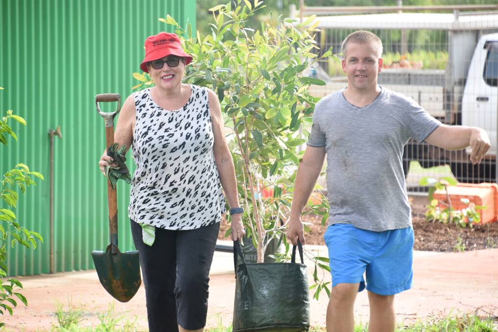 Aldermen Toni Tapp Coutts and Matt Hurley put their green thumbs to use at the hot springs this morning. 