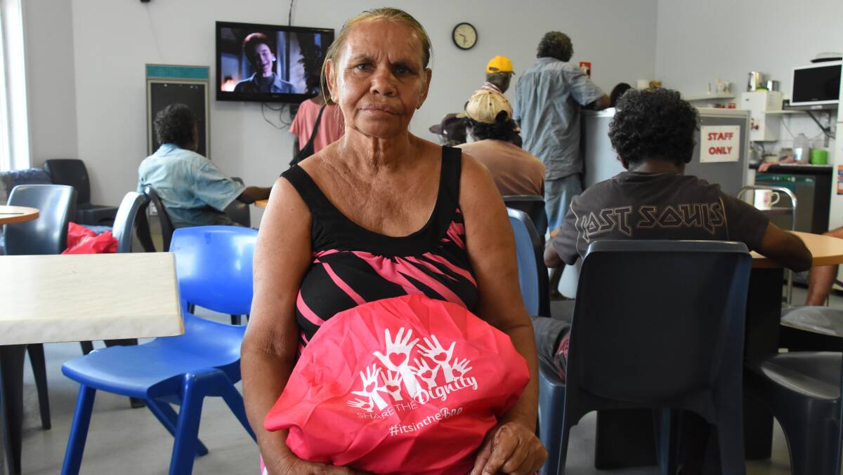 BREAKING BARRIERS: Iris Banjo was one of the women to receive a pink bag filled with sanitary products today at the Katherine Doorways Hub. 