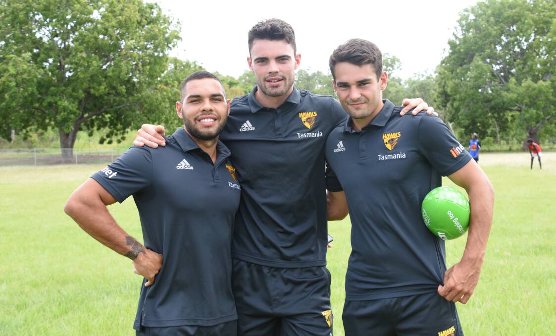 Jarman Impey, Conor Nash and Matthew Walker visited Katherine High school's Clontarf Academy, which engages students through activities such as AFL and writing. 